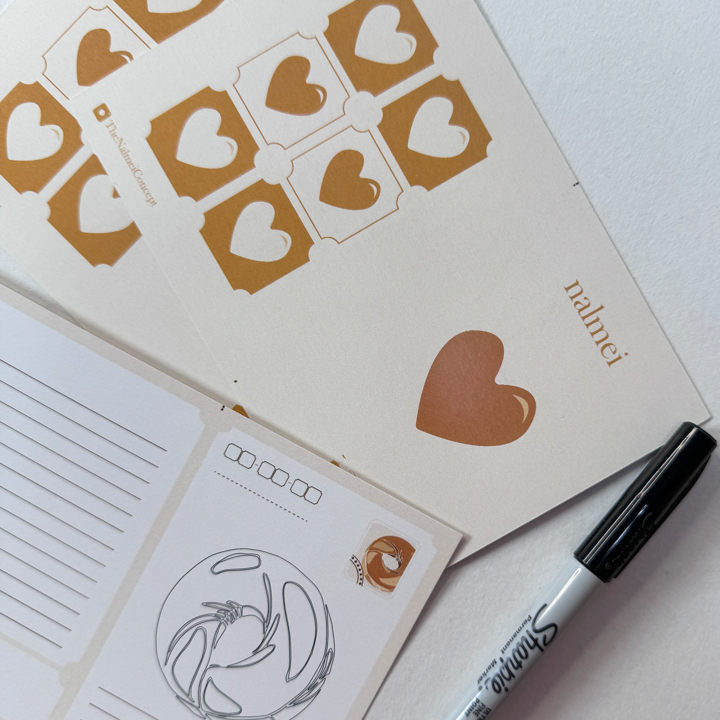 Beige Postcard showing front and back with a sharpie | Nalmei