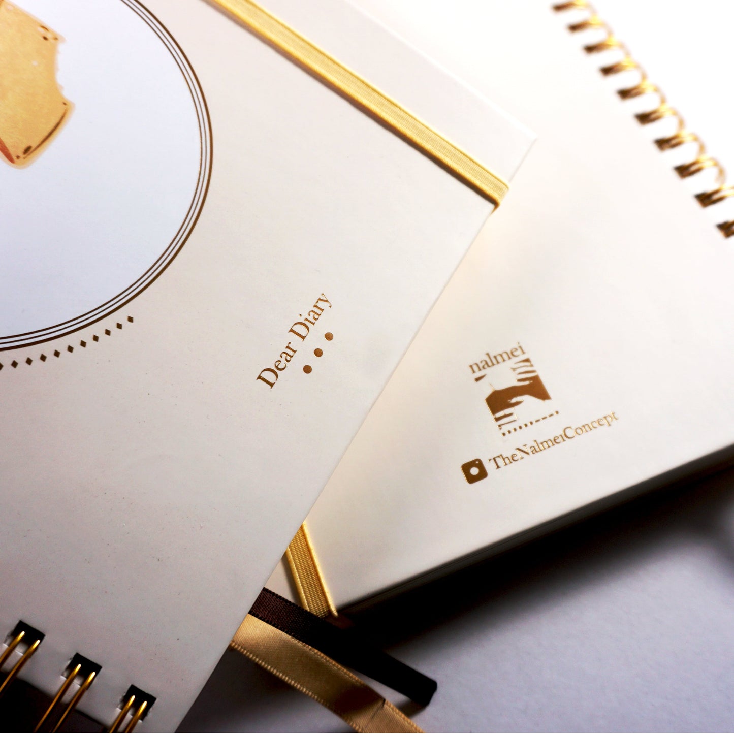 A close up of beige Quotes Journal with showing gold foiling, gold wiro, book marks and elastic | Nalmei