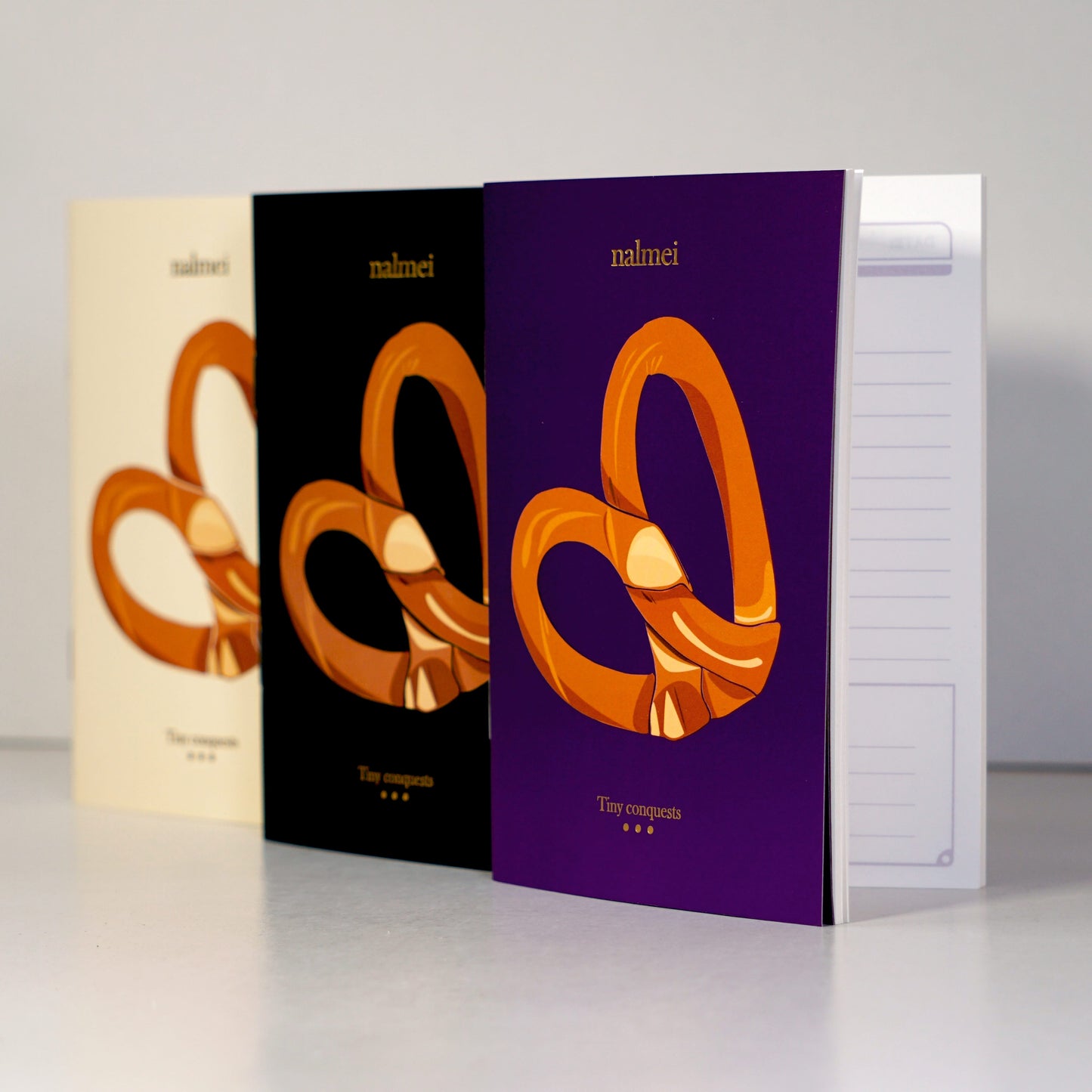 A set of 3 Pretzel To-do List notebooks showcasing the gold foiling work on the front | Nalmei