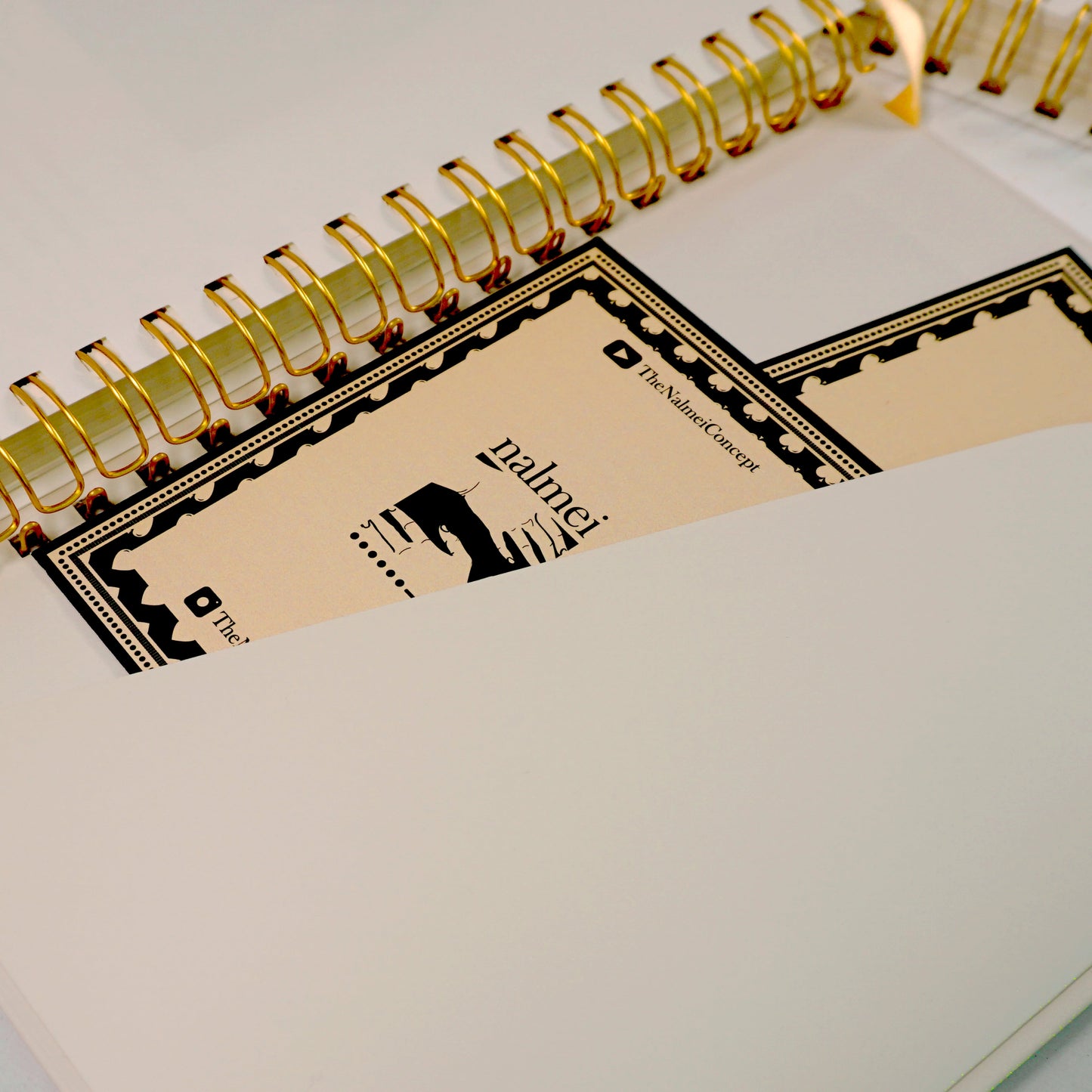 An aesthetic picture of beige activity journal showing the deep pockets of the book perfect for storing small papers | Nalmei