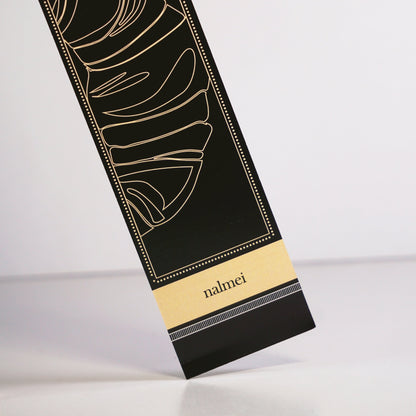 A large black book mark with croissant illustrations | a bookmark for journals
