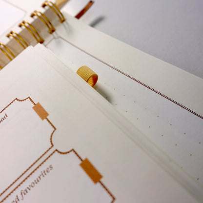 Insides of the beige activity Journal showing the pen loop | Nalmei
